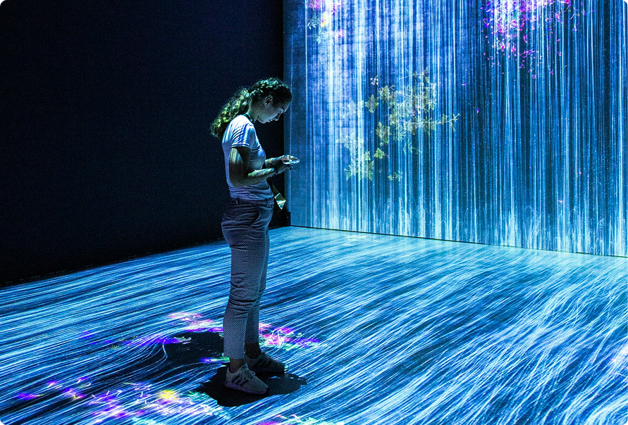 person inside a digital light world display