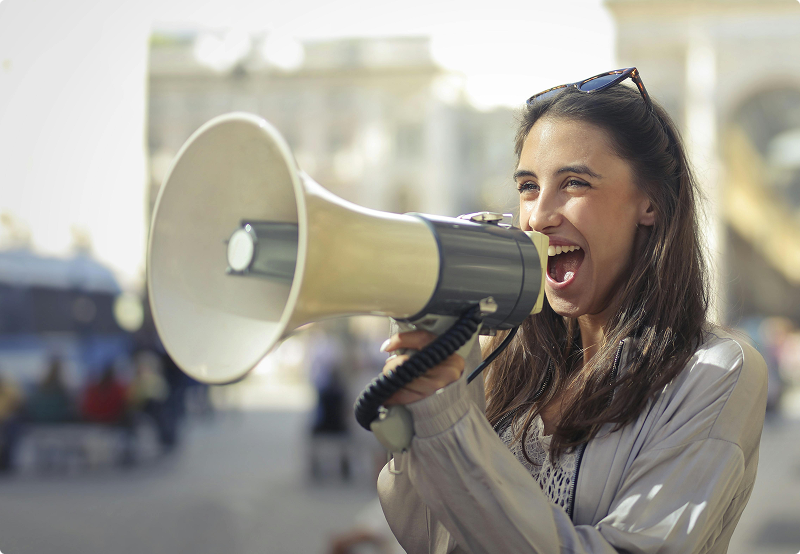 Woman calling out on a megaphone